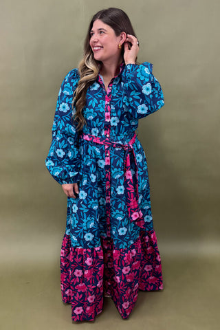 Woman wearing a floral dress with a green background