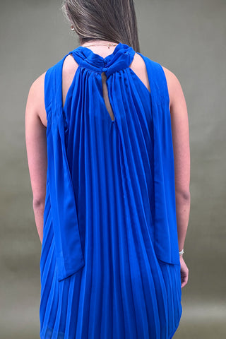 Blue pleated dress with a cut-out back design on a plain background