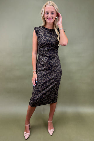 Woman wearing a burgundy dress with a plain background