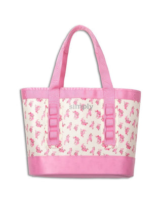 Pink and white tote bag with floral pattern on a white background