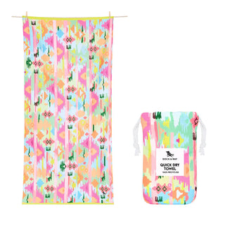 Colorful patterned towel and packaging on a white background