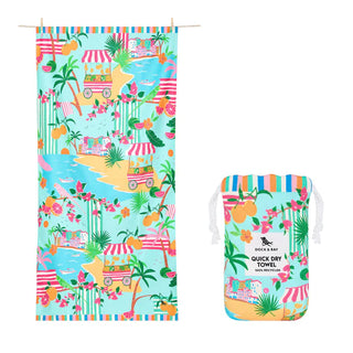 Colorful beach towel with tropical design and matching pouch on a white background