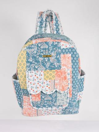 Multicolored patchwork backpack on a white background