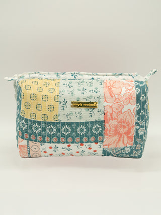 Patchwork pouch with floral patterns on a light background