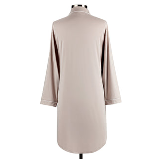 Beige long-sleeve shirt on a mannequin with white trim against a white background