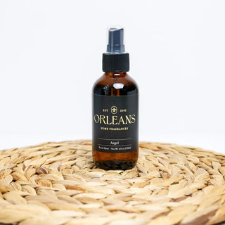 Brown bottle with black label on a woven surface