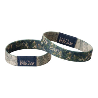 Two wristbands with 'Tap to Pray' text on a white background