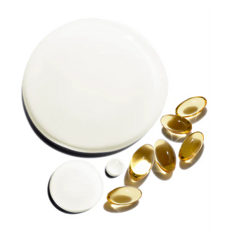 Gold-colored capsules on a white background