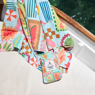 Colorful towel with tropical patterns on a boat
