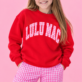 red crewneck sweatshirt with 'LULU MAC' in white arched letters