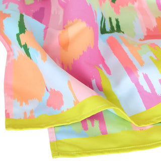 Colorful abstract patterned fabric with a yellow border