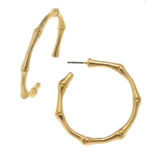 Gold hoop earrings on a white background