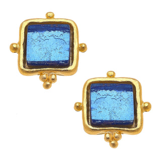 Gold-framed earrings with blue central stones on a white background