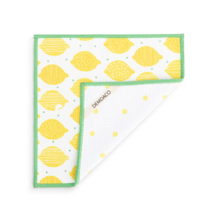 Fabric with lemon pattern and green border on a white background