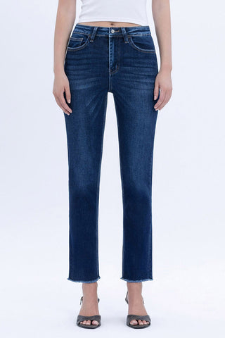 Person wearing blue jeans on a white background