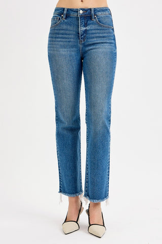 Blue jeans worn by a person on a white background