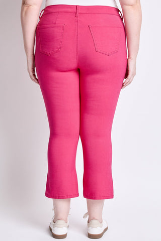 Person wearing bright pink pants on a plain background