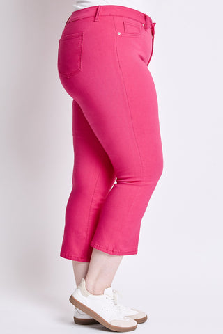 Pink capri pants worn by a person on a white background