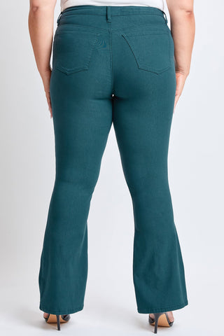 Teal flared pants worn by a person on a white background