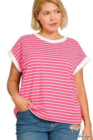 Woman wearing a pink and white striped t-shirt with blue jeans on a white background