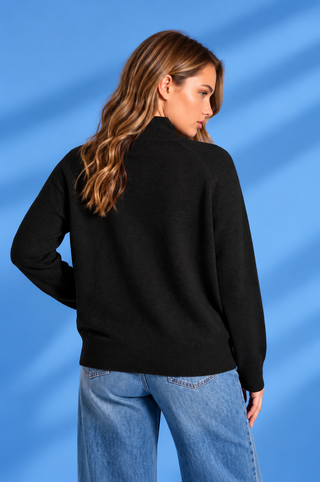 Black mock neck sweater with long sleeves, ribbed cuffs and hem, relaxed fit, and center seam detail.