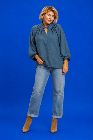 Blue Button Up Tiered Denim Top in soft 100% Tencel with a button front, chest pocket, tiered peplum hem, and relaxed fit.