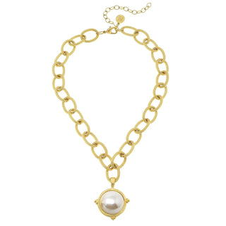 Gold chain necklace with a pearl pendant on a white background