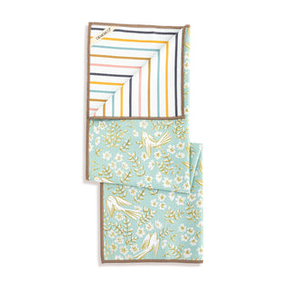 Set of folded napkins with floral and striped patterns on a white background