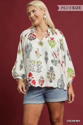 Woman wearing a plus-size cream blouse with floral patterns on a red background