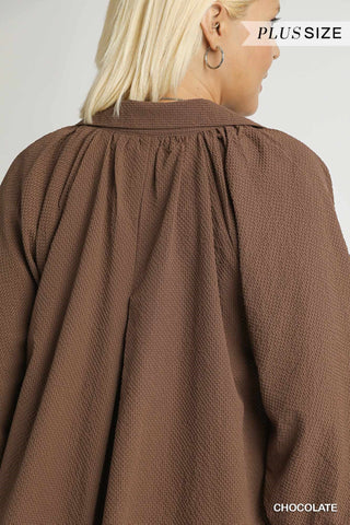Brown textured blouse worn by a model with 'Plus Size' and 'Chocolate' text on a light gray background.