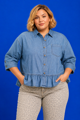 Blue Button Up Tiered Denim Top in soft 100% Tencel with a button front, chest pocket, tiered peplum hem, and relaxed fit.