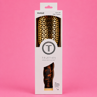 Teleties vented hairbrush packaging on a pink background