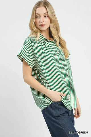 Woman wearing a green and white striped shirt on a white background