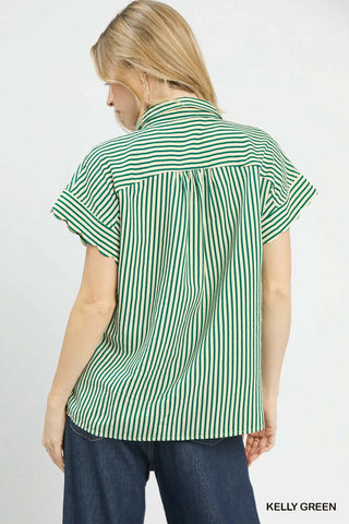 Woman wearing a green and white striped shirt on a plain background
