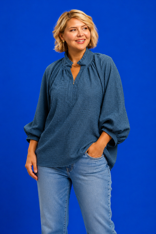 Blue Button Up Tiered Denim Top in soft 100% Tencel with a button front, chest pocket, tiered peplum hem, and relaxed fit.
