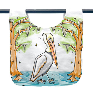 bib with a pelican design in a natural setting