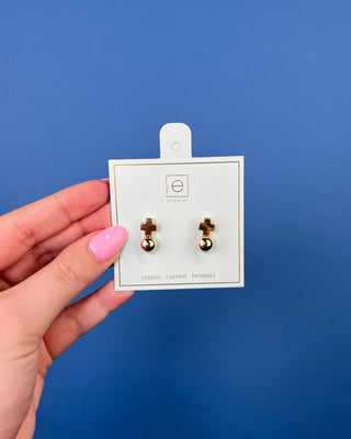 eNewton Signature Cross Gold Stud Earrings in classic gold featuring a polished gold ball with a cross accent and secure post backs, lightweight faith-inspired earrings displayed on an eNewton jewelry card.