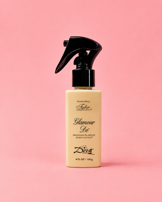 Hand holding a bottle labeled 'Tyler Glamour Do' with a store shelf in the background