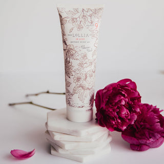 Tube of LORILIA product with pink flowers on a light background