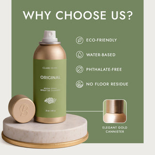 Room spray bottle with green label and gold accents on a white platform against a green background with text about product features.