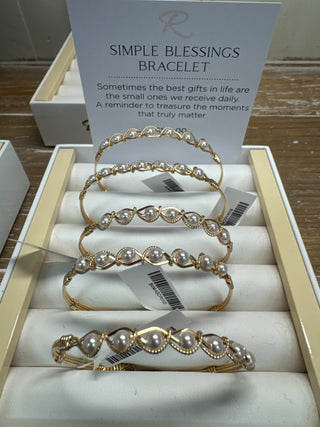 Set of pearl bracelets in a box with a card labeled 'Simple Blessings Bracelet'.