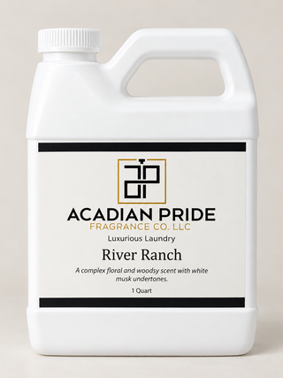 A white plastic jug of Acadian Pride Fragrance Co. LLC 'River Ranch' luxurious laundry scent, 1 Quart, on a light beige background.