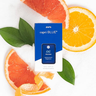 Capri Blue replacement fragrance refill with sliced oranges and leaves on a white background