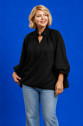 Blue Button Up Tiered Denim Top in soft 100% Tencel with a button front, chest pocket, tiered peplum hem, and relaxed fit.