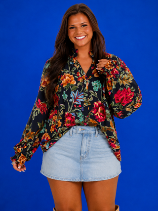V-Neck Navy Top featuring a watercolor floral print, smocked neckline, long sleeves, and a relaxed plus-size fit.