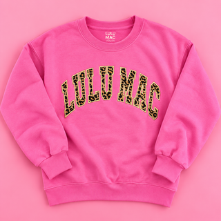 hot pink color paired with bold collegiate-style LULU MAC lettering crafted from classic leopard print