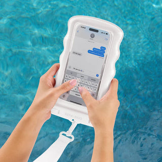 Person using a phone with a waterproof case by a pool