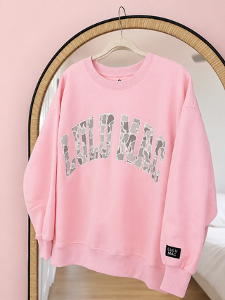 Candy Pink & Camo Crewneck featuring embroidered camo lettering, soft fleece lining, and a cozy everyday fit for kids.