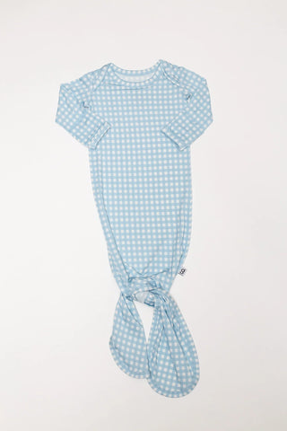 Blue gingham baby swaddle on a white background