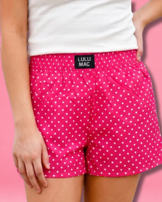 Polka Dot Boxer Shorts featuring a pink and white polka dot print, 100% cotton, elastic waistband, and relaxed fit.